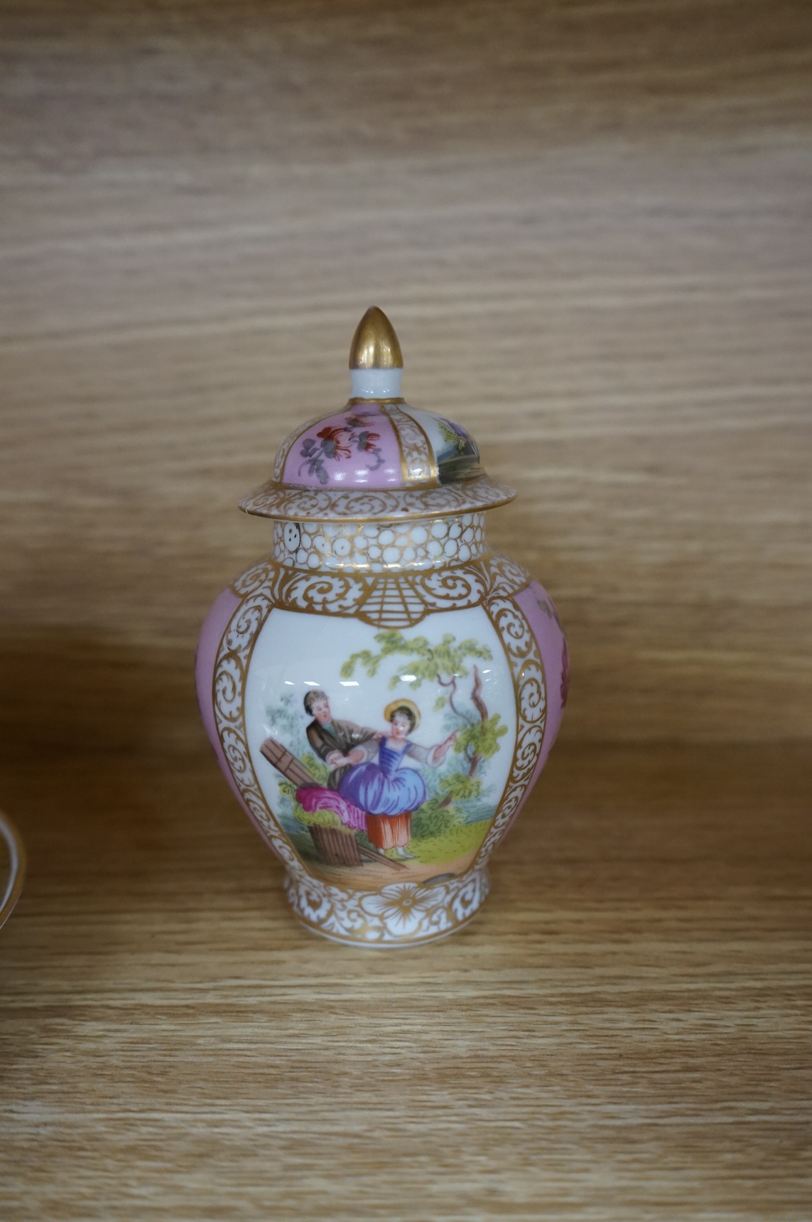 A Worcester butterfly handled cup and saucer and four other items, together with Royal Crown Derby, Dresden and Coalport items. (9). Tallest 13 cm